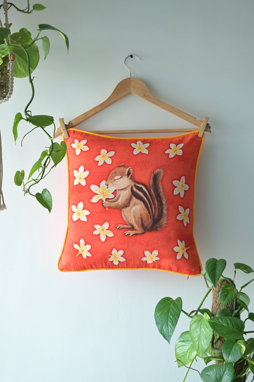 Soft breath shared by frangipani and squirrel 🌼